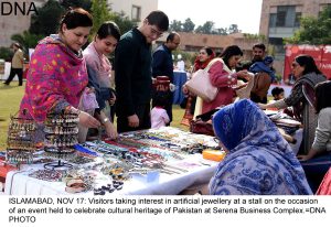 ISLAMABAD, NOV 17: Visitors taking interest in artificial jewellery at a stall on the occasion of an event held to celebrate cultural heritage of Pakistan at Serena Business Complex.=DNA PHOTO