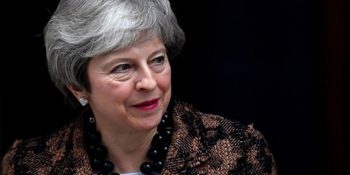 May says to seek 'pragmatic' Brexit solution in Brussels