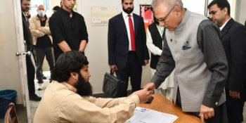 President Alvi casts vote along with family