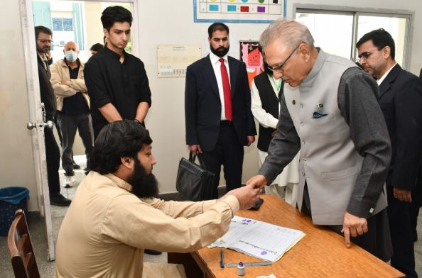 President Alvi casts vote along with family