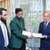 PM GIVES CHEQUE OF RS 2.5 MILLION TO SNOOKER CHAMPION