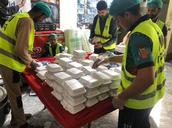 Monal, Rizq Foundation serve meals in flood zones