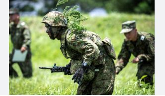 Beijing warns Japan's 'new militarism' poses threat to global peace