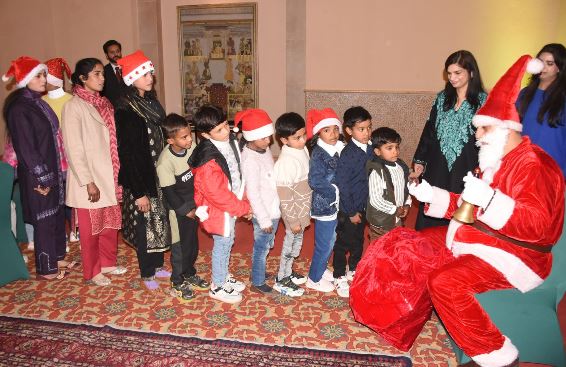 Serena Hotel hosts festive tea party for charity school children