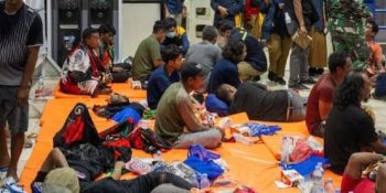 Indonesia rescuers battle turbulent seas in search for 129 people after ship capsizes