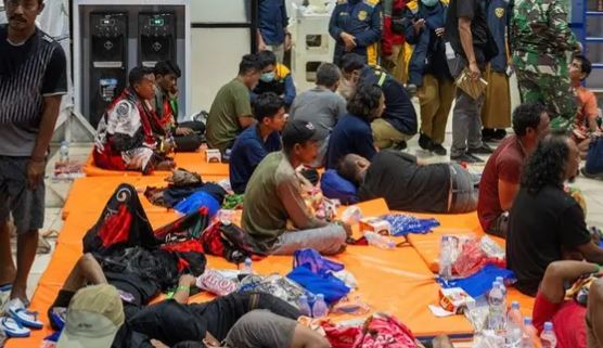 Indonesia rescuers battle turbulent seas in search for 129 people after ship capsizes